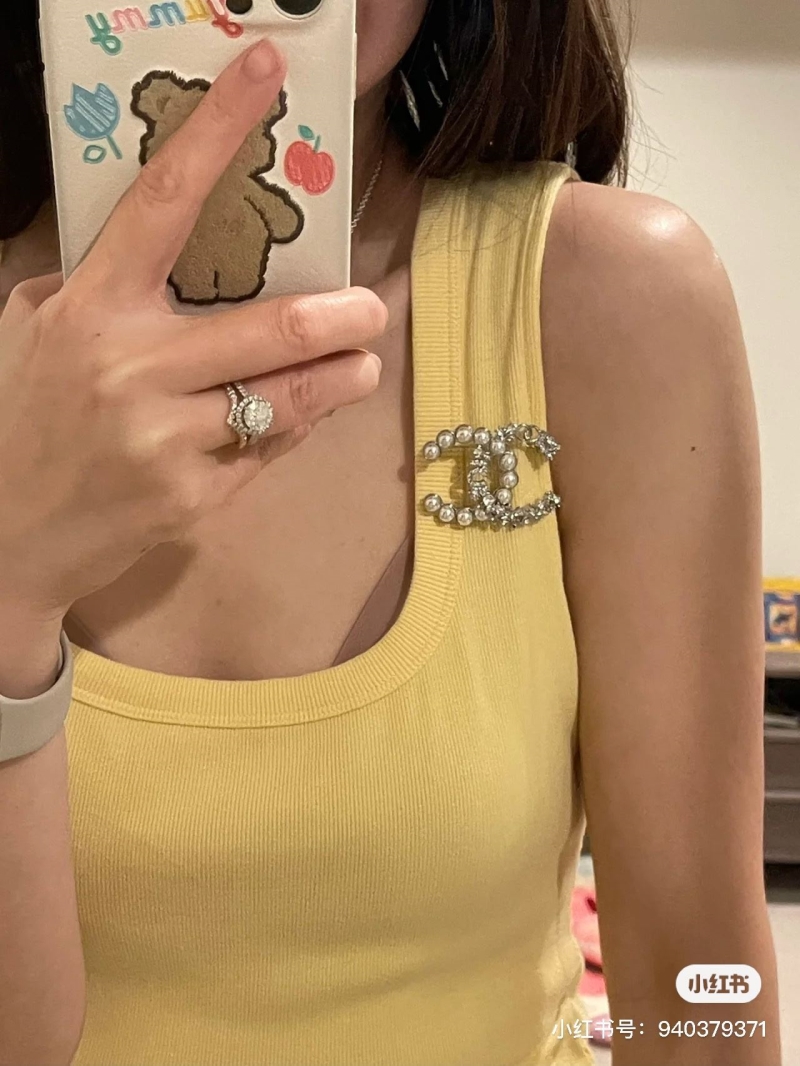 Ch**el brooches